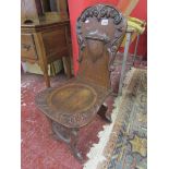 Carved oak hall chair