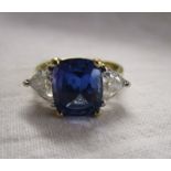 Fine 18ct gold tanzanite ring with large trilliant cut diamonds (3/4 carat) to the shoulders