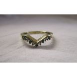 Gold emerald set wishbone ring