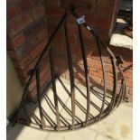 2 cast iron corner hay racks