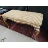 Upholstered stool on cabriole legs