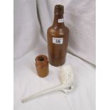 2 stoneware bottles and football themed clay pipe