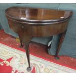 Demilune mahogany fold-over tea table with pad feet