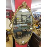 Gilt framed oval mirror