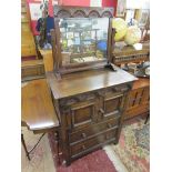 Arts & Crafts carved oak cabinet with dressing mirror