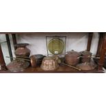 Shelf of metalware, mostly copper and a brass gong