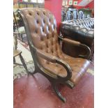 Button back mahogany framed slipper chair in brown leather