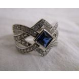 Silver ring set with simulated sapphire & diamond