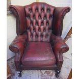 Red leather wing-back armchair