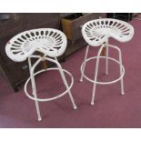 Pair of vintage tractor seat adjustable stools