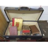 Suitcase containing old books