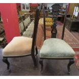 Pair of carved flower back bedroom chairs on casters