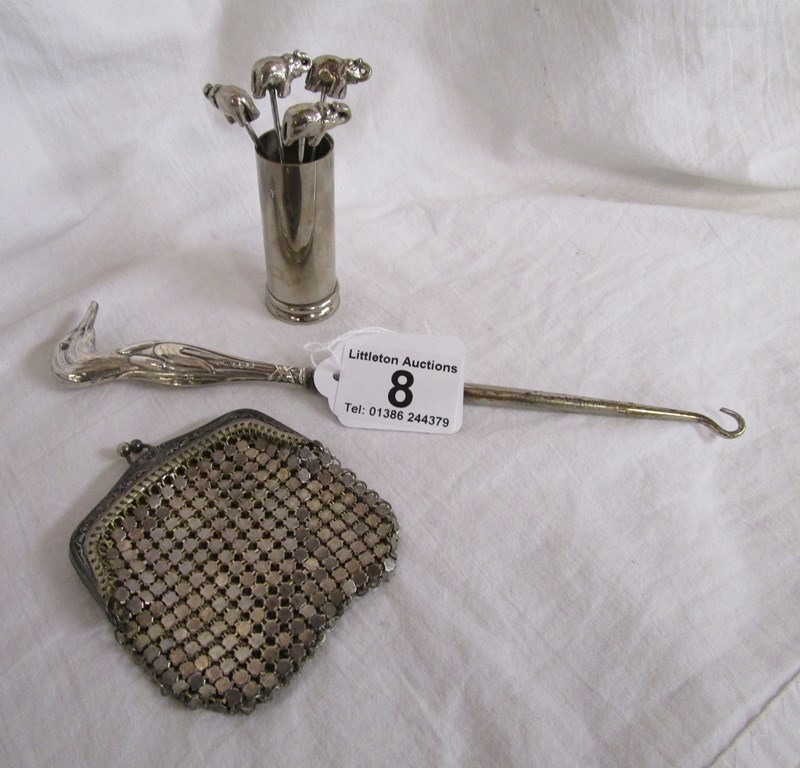 Silver mounted 'bird' button hook, white metal purse and elephant crab forks