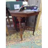 Octagonal occasional table on casters