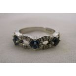 White gold blue topaz & diamond set ring