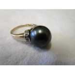 Gold black pearl & diamond set ring