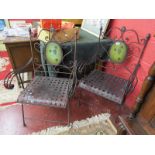Pair of decorative iron elbow chairs