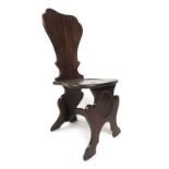 A George II oak slab back hall chair,