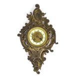 An early 20th century cast brass wall clock,