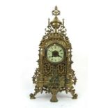 A 19th century French brass clock garniture,