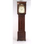 An early 19th century and later mahogany and boxwood strung longcase clock,