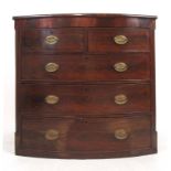 A late 18th century mahogany bow front chest of two short over three long drawers with reeded