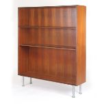 A 1960/70's teak open fronted adjustable bookcase on spun aluminium legs, w.