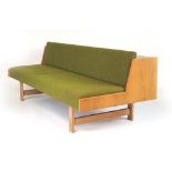 A 1960's oak and upholstered daybed, in the manner of Hans Wegner, l.