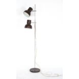 A 1970's brown enamelled twin spot standard lamp CONDITION REPORT: Will require a