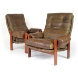 A pair of 1970's highback armchairs with green sectional upholstery on teak frames