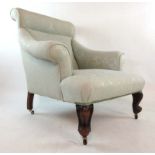 A 19th century walnut nursing chair upholstered in a floral patterned light blue silk fabric on