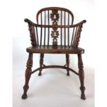 An early 19th century yew and elm Windsor chair,