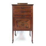 An Edwardian mahogany, satinwood banded and pen work music cabinet,