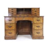 An Edwardian burr walnut knee hole desk,