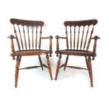 A pair of 19th century oak open armchairs,