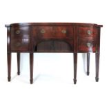 A late 18th century mahogany and boxwood strung bow front sideboard,