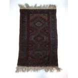 A handwoven Persian prayer rug,