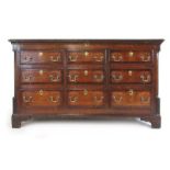 A mid 18th century oak and mahogany banded mule chest,