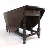 An 18th century oak gate leg table,