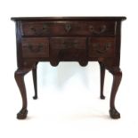 A mid 18th century walnut lowboy,