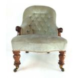 A 19th century mahogany nursing chair upholstered in a mint green button back cut fabric,