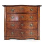 A late 19th century continental walnut serpentine chest of drawers,