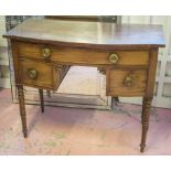 BOWFRONT DRESSING TABLE, Regency mahogany with one long and two short drawers,