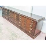 BANK OF GRADUATED DRAWERS, 19th century mahogany with original brass handles,