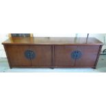 CHINESE LONG SIDEBOARD, elm, four doors with decorative metal work, 52cm x 77cm H x 186cm.