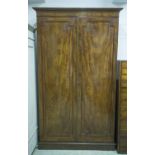 WARDROBE, William IV flame mahogany with two panelled doors, double hanging space and plinth,