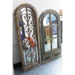 WINDOW MIRRORS, two, both distressed, one with scrolling metal work, the other with coat hooks,