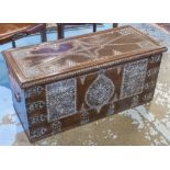 ZANZIBAR TRUNK, 19th century hardwood and brass studded with rising lid and carrying handles,