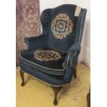 WING ARMCHAIR, Georgian style, blue and medallion upholstery, cabriole front legs.