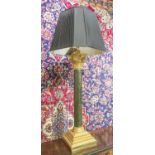 LARGE TABLE LAMP OF CLASSICAL COLUMN FORM, ebonised and gilt wood, with shade, 107cm H overall.